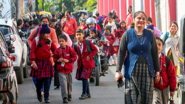 Students going to attend their school that reopened days after violence broke out over the demolition of an 'illegally built' madrasa, in Haldwani