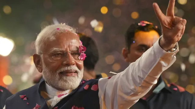 Prime Minister Narendra Modi greets supporters upon their arrival for a meeting at the party headquarters as the party leads in the Lok Sabha elections amid the counting of votes, in New Delhi, Tuesday, June 4, 2024