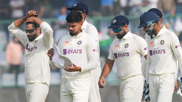 Indian bowler Ravindra Jadeja with teammates after the wicket of Australian captain Pat Cummins during the third day of the 2nd test cricket match against Australia