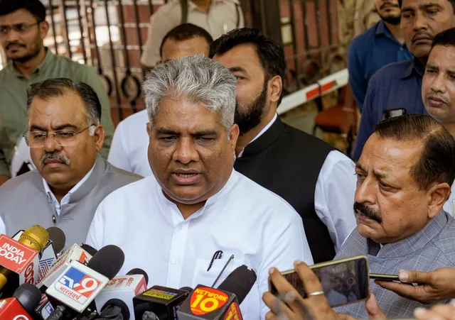 Union Minister and BJP leader Bhupender Yadav with party leaders Jitendra Singh and Tarun Chugh speaks with the media after meeting the Chief Election Commissioner