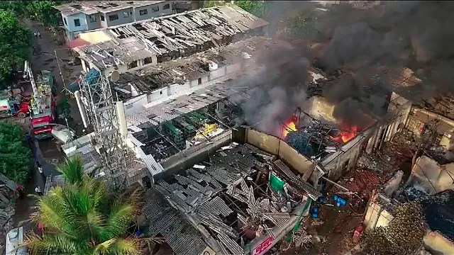 Smoke billows after a fire broke out due to a boiler blast in a chemicals factory, at Dombivli, in Thane district, Thursday, May 23, 2024