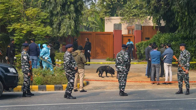 Security officials with the Forensic and K9 unit near the Israel Embassy during an investigation after a reported low intensity blast nearby, in New Delhi