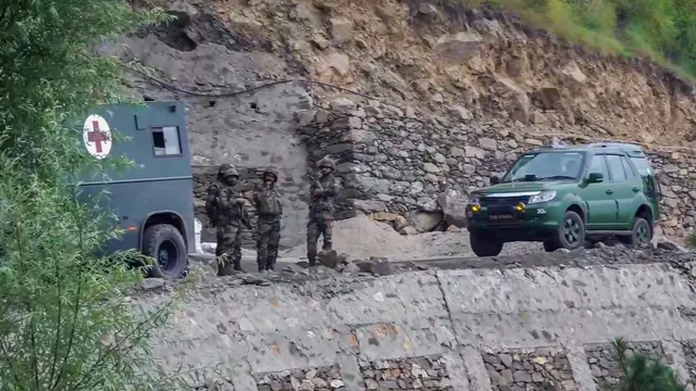 Security personnel keep a vigil after an early morning encounter with terrorists, in Doda district, Thursday, July 18, 2024.