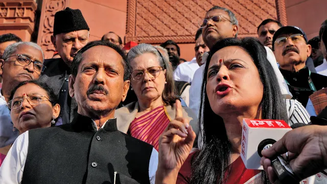 TMC leader Mahua Moitra speaks to the media after her expulsion from the Lok Sabha over cash-for-query issue during the Winter session of Parliament, in New Delhi, Friday, Dec. 8, 2023. Sonia Gandhi is also seen behind Moitra.