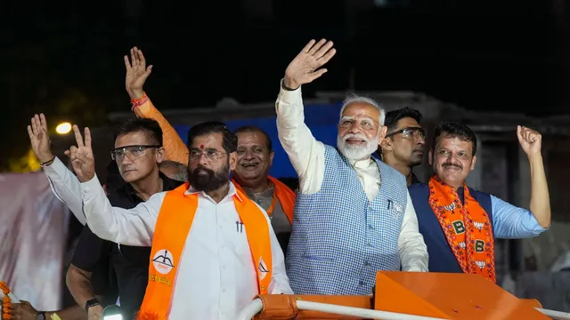 Prime Minister Narendra Modi, Maharashtra Chief Minister Eknath Shinde and Deputy Chief Minister Devendra Fadnavis during a roadshow, for Lok Sabha polls, in Mumbai, Wednesday, May 15, 2024