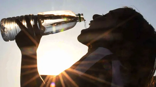 A child drinks water on a hot summer day, Saturday, May 25, 2024