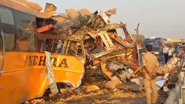 Locals near the wreckage of a bus and a truck after their collision on Agra-Lucknow Expressway, near Kannauj, Tuesday, April 23, 2024