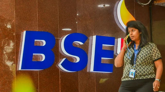 A pedestrian walks past the Bombay Stock Exchange (BSE) building, in Mumbai