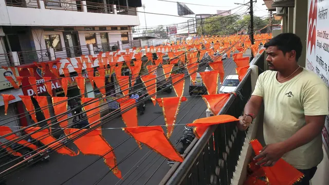 Man taking off saffron flags