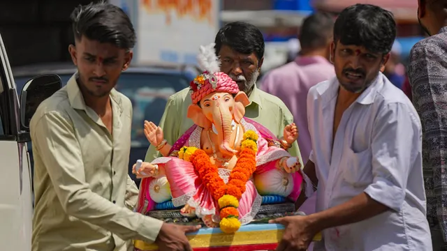 People carry an idol of Lord Ganesha on the occasion of Ganesh Chaturti festival, in Mumbai