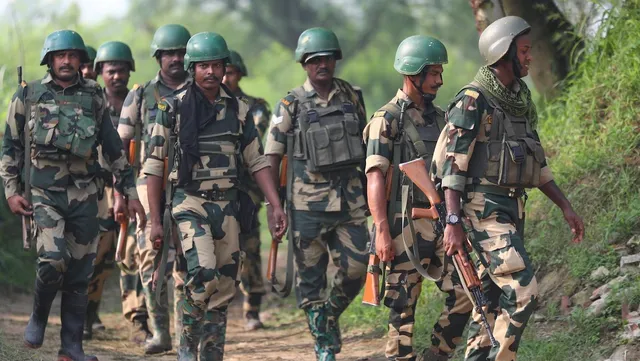 BSF personnel patrol near the international border after foiling an infiltration attempt in Arnia sector on the outskirts of Jammu, Monday, July 31