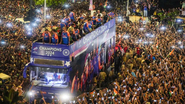 Players of the T20 World Cup-winning Indian cricket team acknowledge fans during their open bus victory parade, in Mumbai, Thursday, July 4, 2024.