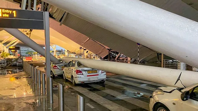 Vehicles are crushed after a portion of the roof at the Delhi airport's Terminal-1 collapsed amid heavy rainfall, in New Delhi, early Friday, June 28, 2024.