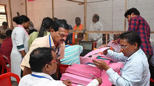 Poll officials at a counting centre during counting of votes for Lok Sabha elections, in Bhubaneswar, Tuesday, June 4, 2024