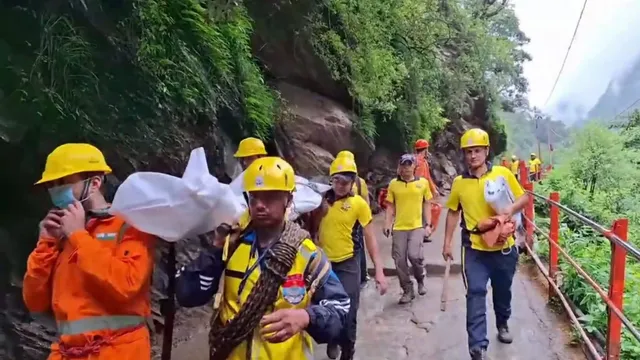 SDRF personnel conduct a rescue operation following a landslide on the Kedarnath trekking route, in Rudraprayag district, Sunday, July 21, 2024.