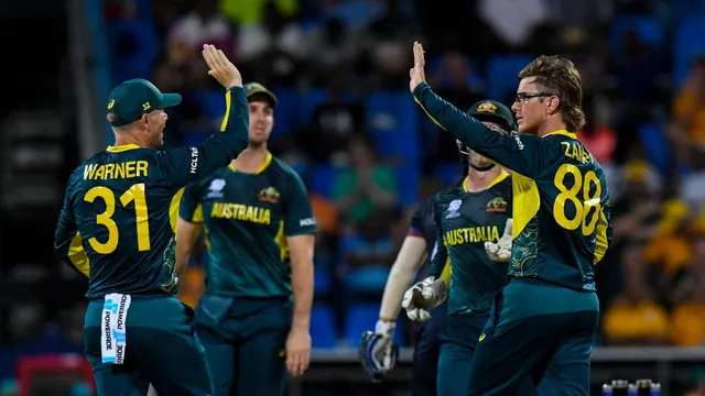 Australia’s Adam Zampa (right) celebrates the dismissal of Namibia’s Zane Green (partly seen) during the ICC men’s Twenty20 World Cup 2024 group B cricket match on June 11, 2024