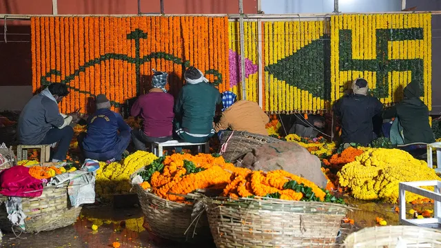 Workers prepare decorations ahead of Prime Minister Narendra Modi's visit, in Ayodhya