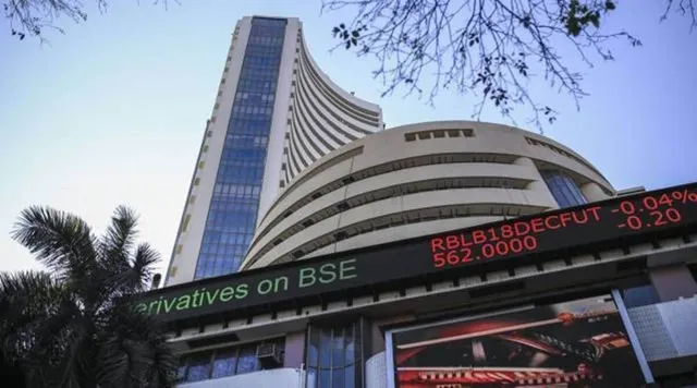 Sensex edges lower by 15 points, Nifty retreats from record highs to settle flat