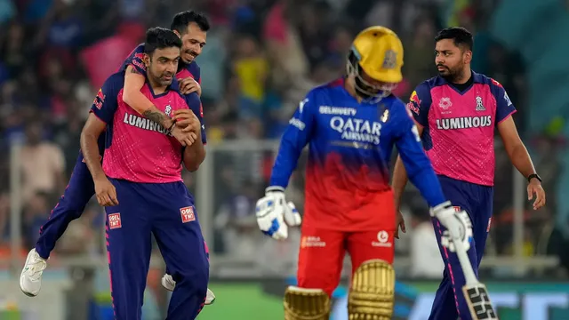 Rajasthan Royals' Ravichandran Ashwin with teammates celebrates the wicket of Royal Challengers Bengaluru's player Glenn Maxwell during the Indian Premier League (IPL) 2024 T20 cricket match