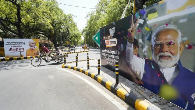 A banner of Prime Minister-Designate Narendra Modi ahead of his swearing-in ceremony as PM for the third consecutive term, in New Delhi, Sunday, June 9, 2024.