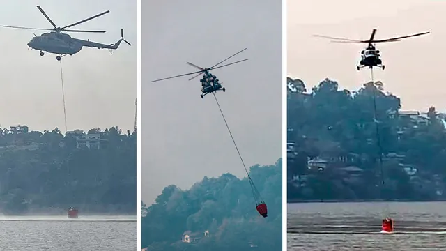 A Mi-17 V5 helicopter of the Indian Air Force conducts 'Bambi Bucket Operation' to control the fire that broke out in the forests of Kumaon division, in Nainital district, Saturday, April 27, 2024