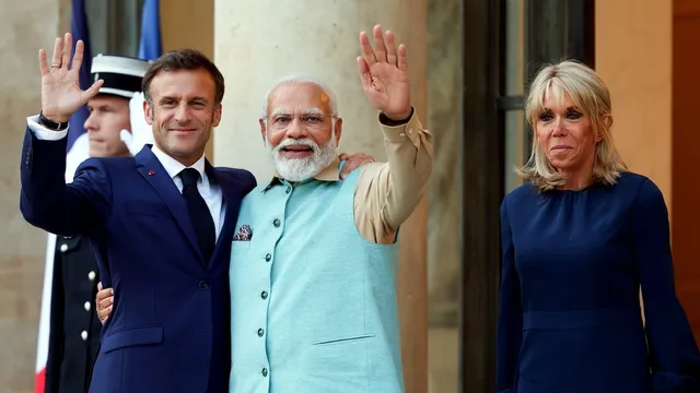 Prime Minister Narendra Modi being welcomed by the President of the France Emmanuel Macron, as President's wife Brigitte Macron looks on, at Elysee Palace, in Paris, Thursday, July 1