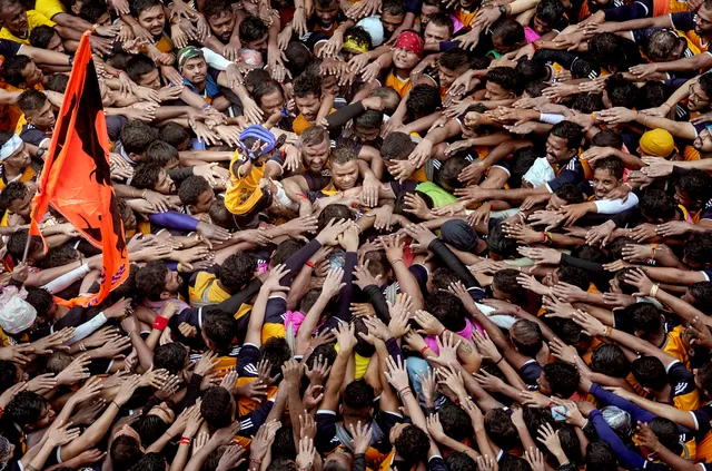 Govindas take part in 'Dahi Handi' celebrations on the occasion of Krishna Janmashtami at Dadar, in Mumbai, Thursday.jpg