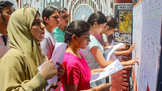 Candidates undergo security check as they arrive to appear for the NEET (UG) 2024 exam at an examination centre