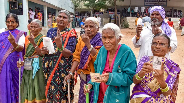 Voters show their fingers marked with indelible ink after casting their votes for the Telangana Assembly elections, in Hyderabad