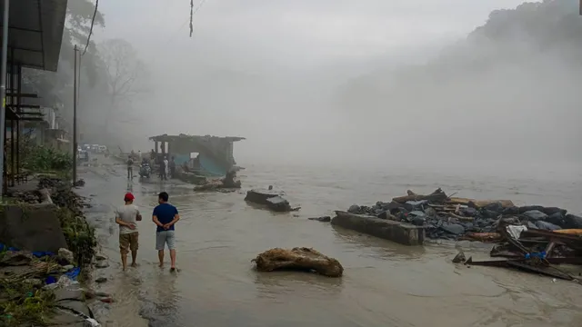 A flooded road along the swollen Teesta river after heavy rainfall, in Sikkim, Monday, June 17, 2024.