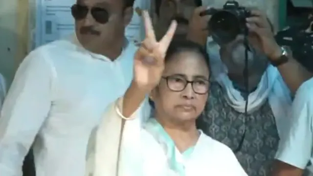 West Bengal CM Mamata Banerjee shows victory sign after casting her vote at a polling booth in Kolkata