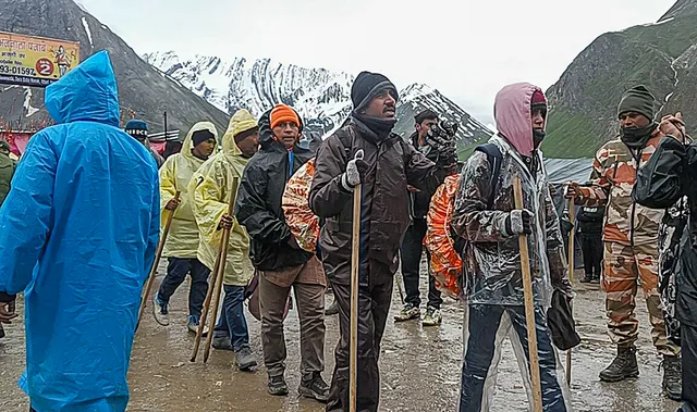 Pilgrims at Panchtarni base camp after the Amarnath Yatra was temporarily suspended for third consecutive day due to bad weather, in Anantnag district, Sunday.jpg