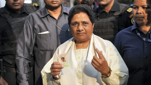 BSP Supremo Mayawati shows her ink-marked finger and ID card after casting her vote for the fifth phase of Lok Sabha elections, in Lucknow, Monday, May 20, 2024