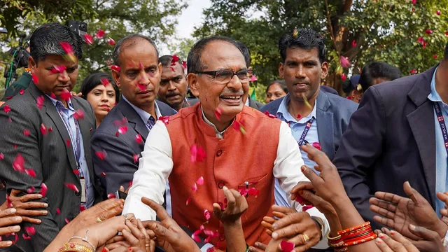 Madhya Pradesh Chief Minister Shivraj Singh Chouhan with BJP workers and supporters celebrates the party's lead during counting of votes for MP Assembly elections