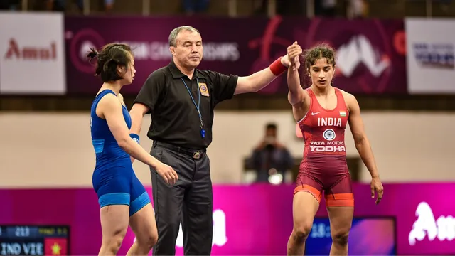 In this Feb. 21, 2020 file photo, Referee raises the hand of Indian wrestler Vinesh Phogat after she defeated Thi Ly Kieu of Vietnam during the 53kg category match of the Senior Asian Wrestling Championships, in New Delhi.