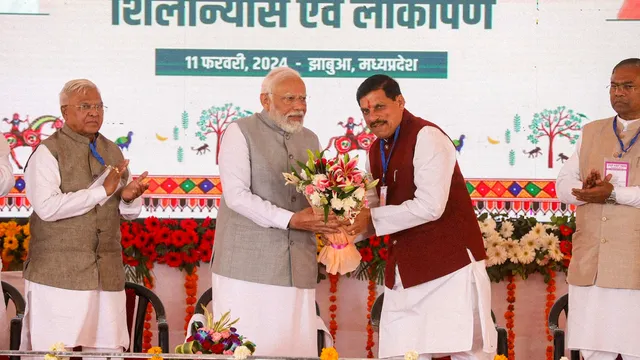 Prime Minister Narendra Modi being welcomed by Madhya Pradesh Chief Minister Mohan Yadav as Governor Mangu Bhai Patel looks on