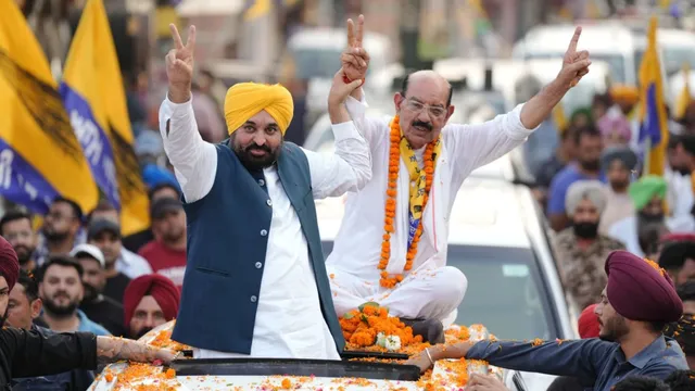 Punjab Chief Minister Bhagwant Mann with party's candidate, for Jalandhar West seat, Mohinder Bhagat