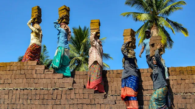 Women labourers work at a brick kiln ahead of International Women's Day, in Karad