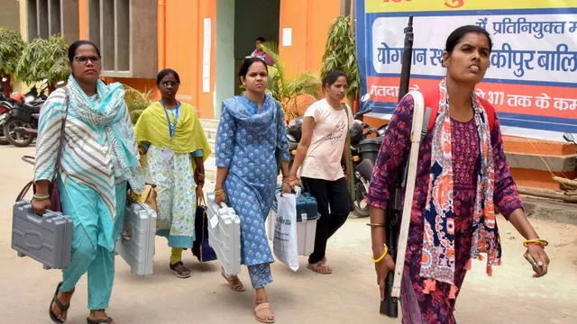 Polling officials carrying Electronic Voting Machines (EVM) and other election related materials leave for their respective polling booths, on the eve of the seventh phase of Lok Sabha polls, at Kanya M.S. Golghar Park, in Patna, Friday, May 31, 2024