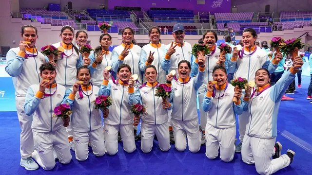 Gold medalist Indian team poses for photos during the presentation ceremony after the Women's Team Gold Medal Kabaddi match against Chinese Taipei at the 19th Asian Games