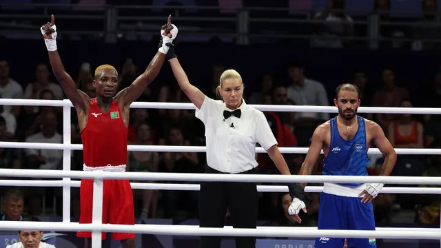 Patrick Chinyemba of Zambia (red) wins against Amit Panghal of India (blue) in their Men's 51kg round of 16 bout of the Boxing competitions in the Paris 2024 Olympic Games, at the North Paris Arena in Villepinte, France, 30 July 2024.