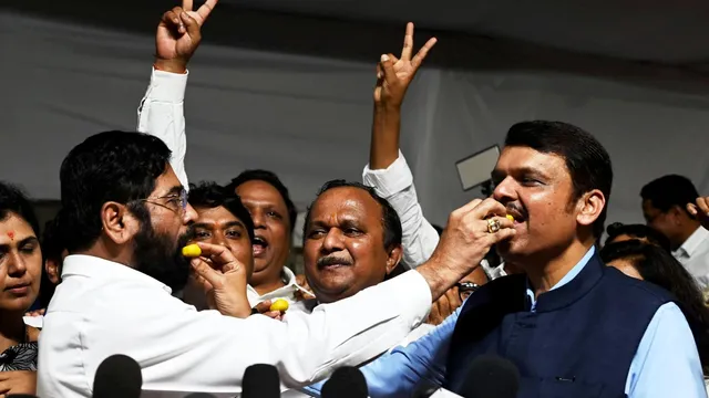 Maharashtra Chief Minister Eknath Shinde and Deputy CM Devendra Fadnavis celebrate after the victory of all nine Mahayuti (ruling alliance) candidates in the state Legislative Council polls at Vidhan Bhavan, in Mumbai, Friday, July 12, 2024.