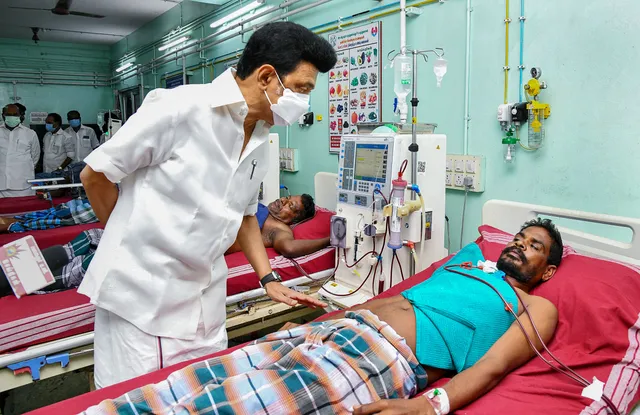 Tamil Nadu Chief Minister M.K. Stalin meets a person who fell ill after allegedly consuming spurious liquor, at Government Medical College in Villupuram district