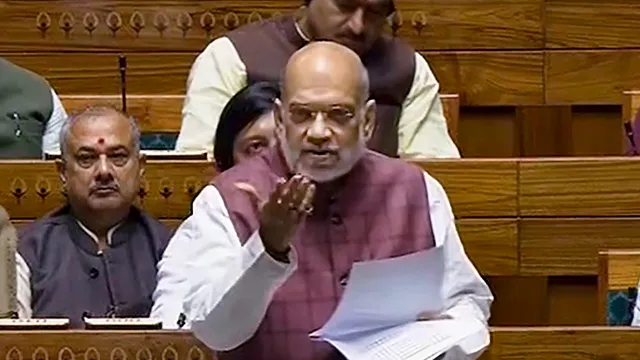 Union Home Minister Amit Shah speaks in the Lok Sabha during the Winter session of Parliament