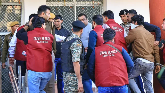 Rajasthan Police personnel and Delhi Police's Crime Branch arrive with accused of Shri Rashtriya Rajput Karni Sena's president Sukhdev Singh Gogamedi murder case at Sodala Police Station, in Jaipur, Sunday, Dec. 10, 2023.