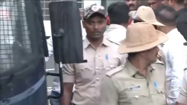 Actor Darshan Thoogudeepa being brought out of Annapoorneshwari Nagar Police Station. 