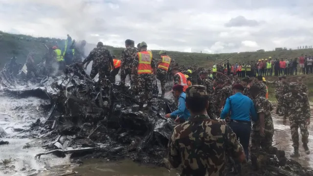 Nepali Army personnel during a rescue operation after an plane crashed at Tribhuvan International Airport, in Kathmandu.