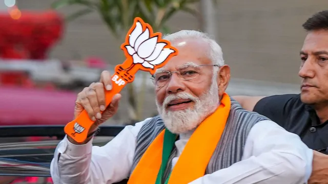 Prime Minister Narendra Modi during a roadshow for Lok Sabha elections, in Kanpur, Saturday, May 4, 2024