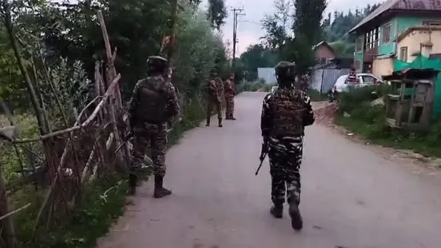 Security personnel keep vigil during an encounter in Ahlan Gadole in the Kokernag area of the south Kashmir district, Sunday, Aug. 11, 2024.