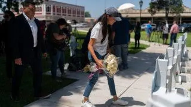 Duchess of Sussex, leaves flowers at a memorial site, Thursday, May 26, 2022, for the victims killed in this week’s elementary school shooting in Uvalde.